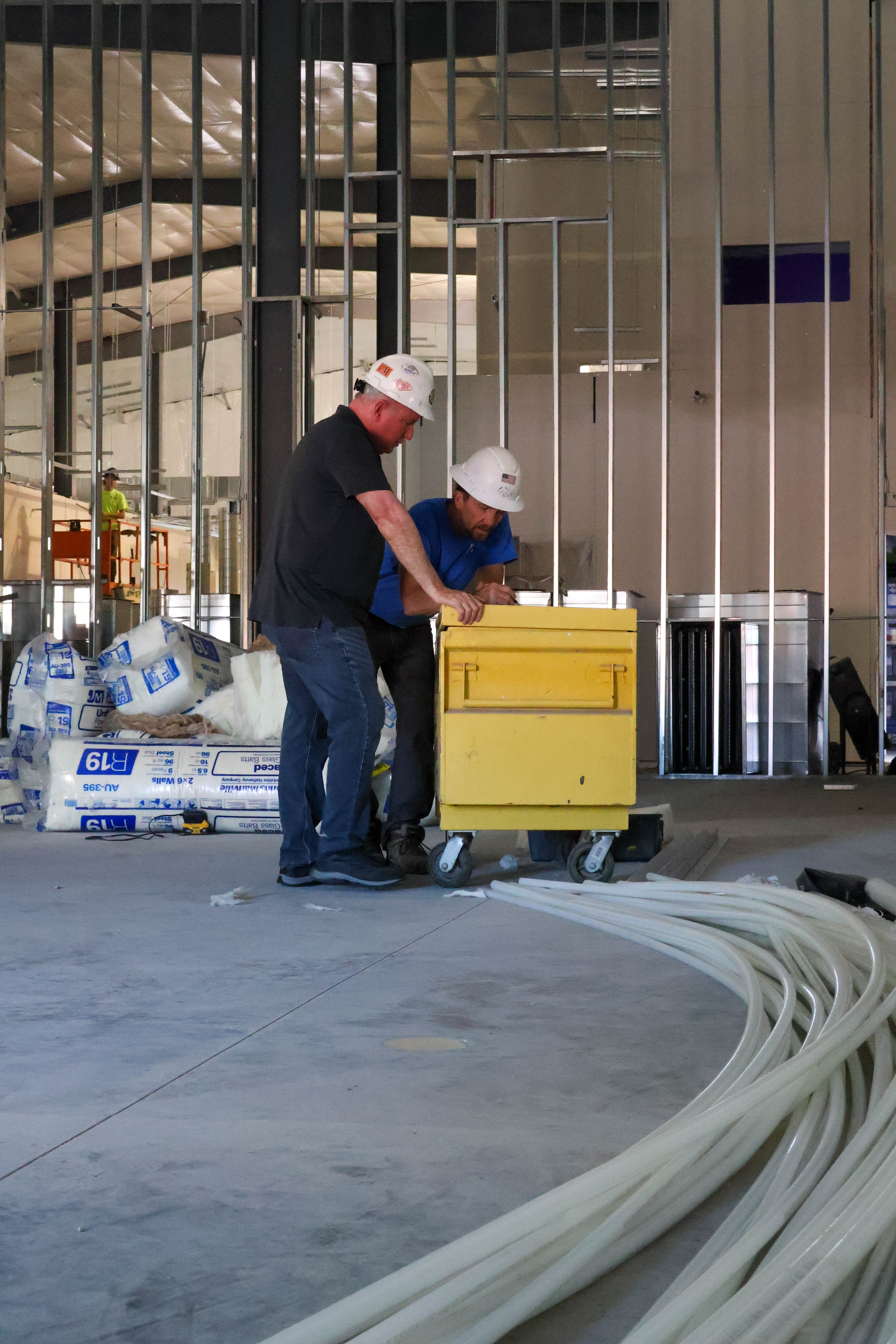 Northern Electric IT Manager Derek Gorecki, left, meets with JDH’s Project Manager to go over details for the multi-use room.