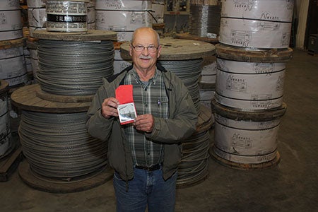 Daryl Rieck holding childhood photo